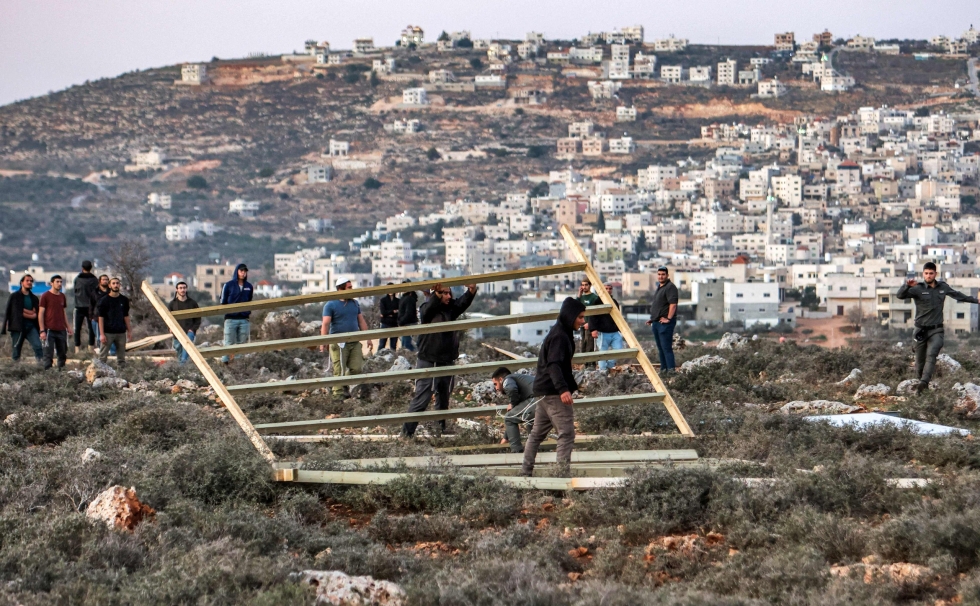 Israel ilmoitti sunnuntaina aikovansa laillistaa yhdeksän siirtokuntaa miehitetyllä Länsirannalla ja rakentavansa 10 000 uutta kotia siirtokuntalaisille. LEHTIKUVA / AFP
