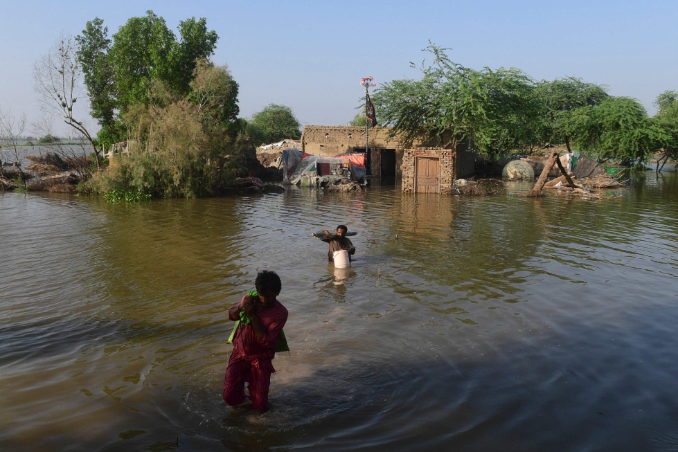 Kesäkuussa alkaneet tulvat ovat tuhonneet täysin tai vahingoittaneet yli miljoona kotia. Lehtikuva/AFP