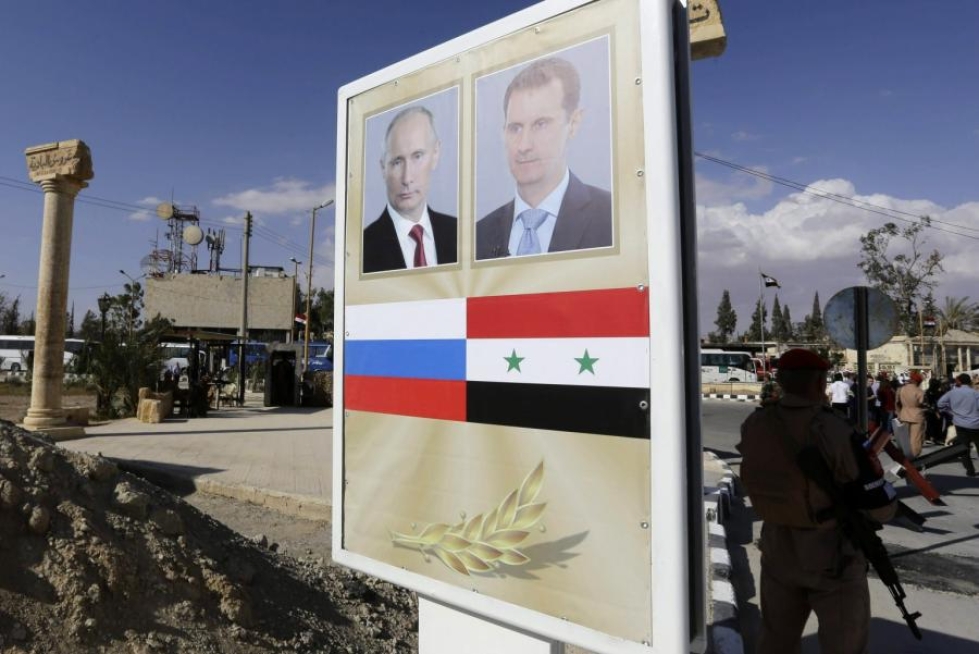 Syyriassa julisteessa maan presidentti Bashar al-Assad ja Venäjän presidentti Vladimir Putin. LEHTIKUVA/AFP