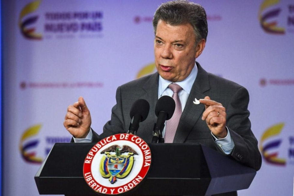 Kolumbian presidentin Juan Manuel Santosin mukaan hallitus ja ELN-sissiliike ovat valmiita aloittamaan neuvottelut rauhasta. LEHTIKUVA/AFP