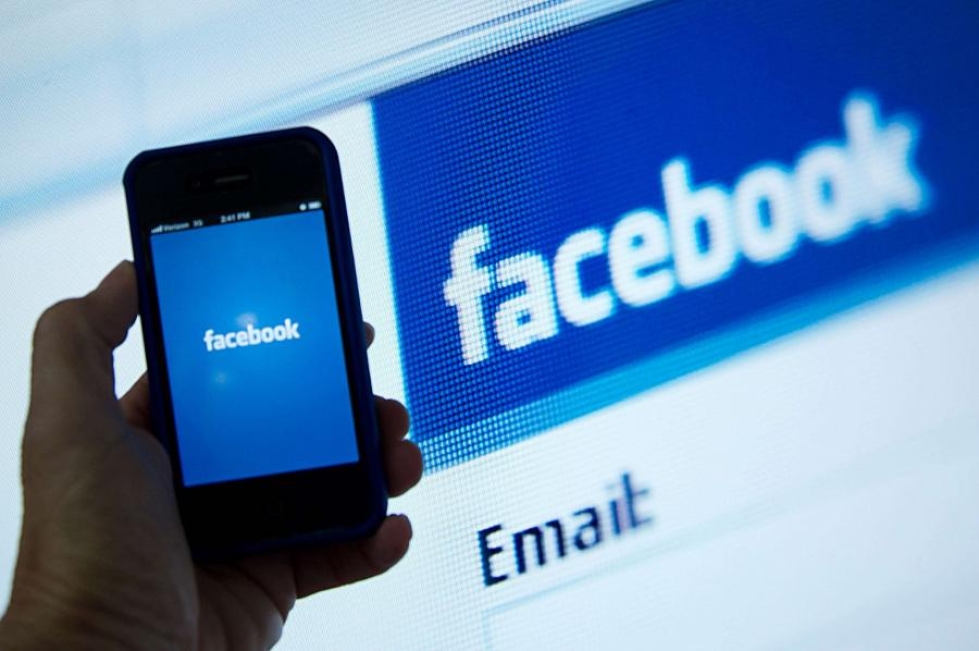 Facebookin käyttö kasvoi erityisesti mobiililaitteilla. LEHTIKUVA/AFP