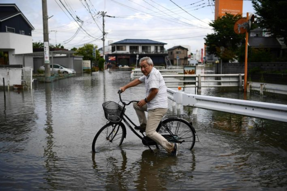 Rankkasateet ovat aiheuttaneet laajoja tulvia ja maanvyöryjä Japanin lounaisosassa. LEHTIKUVA/AFP