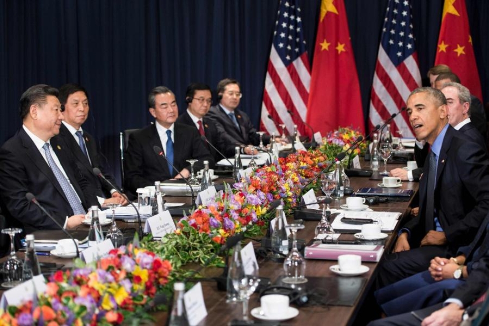 Kiinan presidentti Xi Jinping (vas.) ja Yhdysvaltain väistyvä presidentti Barack Obama (oik.) tapasivat viimeistä kertaa Obaman presidenttiyden aikana. LEHTIKUVA/AFP