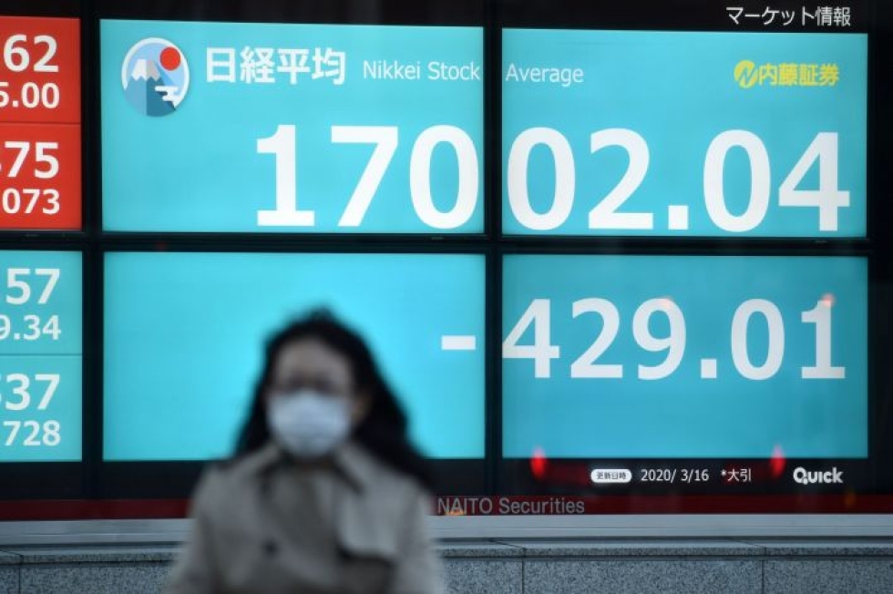 Japanissa pörssi päätyi nousulukemiin synkän maanantain jälkeen. LEHTIKUVA/AFP