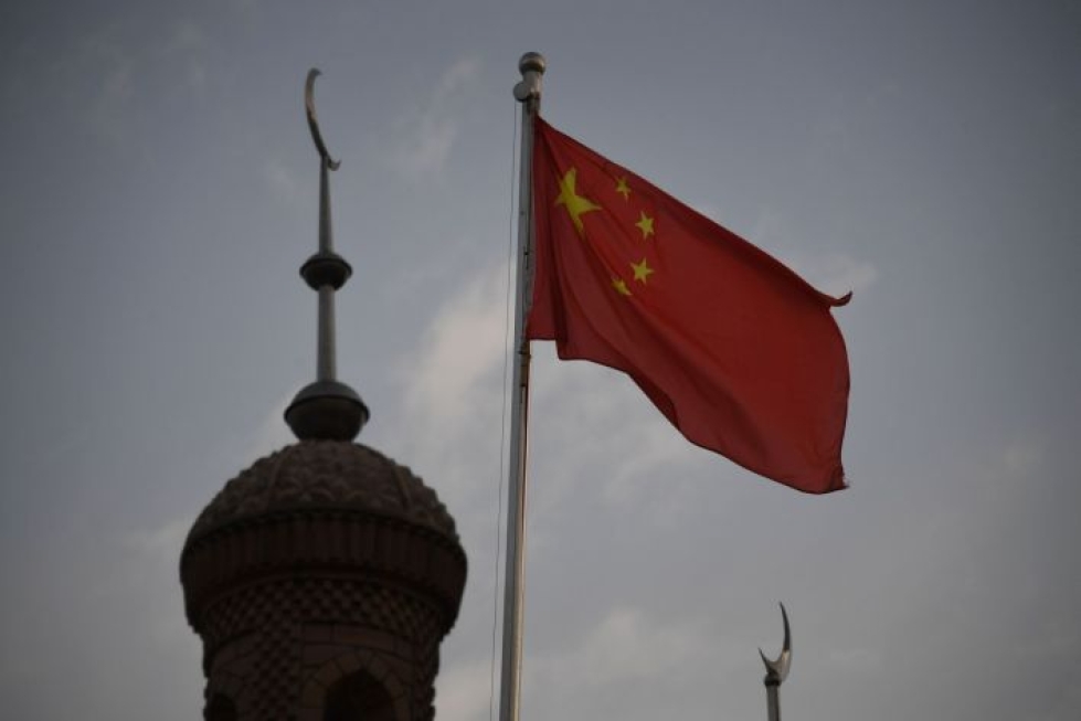 Kiina uhkaa Yhdysvaltoja seuraamuksilla, sillä edustajainhuone hyväksyi tiistaina lakihankkeen, joka mahdollistaisi pakotteet kiinalaisille virkamiehille uiguurien kohtelun takia. LEHTIKUVA / AFP