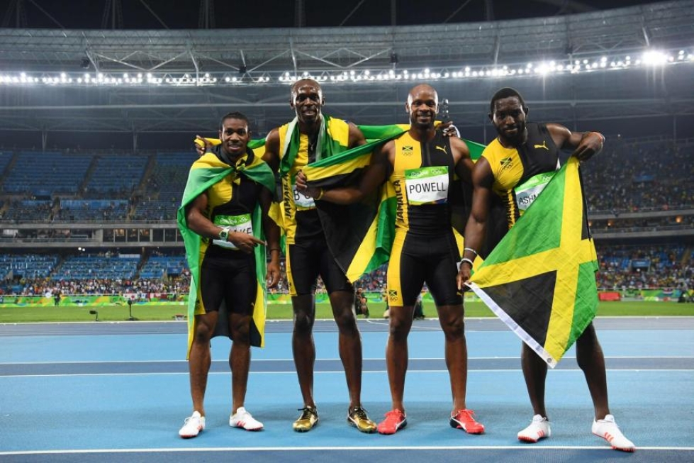 Jamaikan pikaviestijoukkueen Usain Bolt, Yohan Blake, Asafa Powell ja Nickel Ashmeade pyyhälsivät olympiavoittoon ajalla 37,27. LEHTIKUVA/AFP