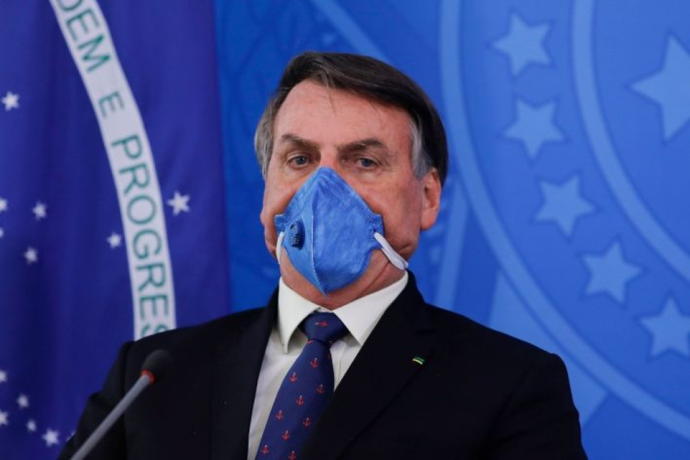Presidentti Bolsonaro on kritisoinut rajuja karanteenitoimia. Lehtikuva/AFP