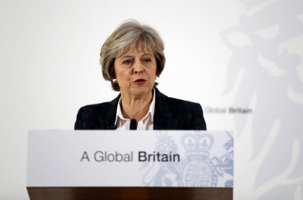 Theresa May korostaa, että Britannia jättää EU:n mutta ei Eurooppaa. LEHTIKUVA/AFP