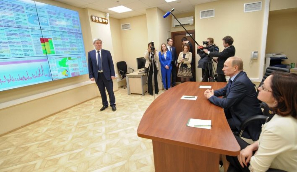 Venäjän presidentti Vladimir Putin vierailulla Rosfinmonitoringissa Moskovassa maaliskuussa 2014. LEHTIKUVA/AFP