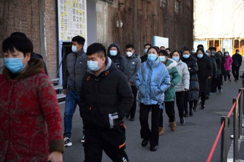 Kiina on pyrkinyt hillitsemään kasvavaa tartuntamäärää rokotuksilla ja rajoituksilla. LEHTIKUVA/AFP