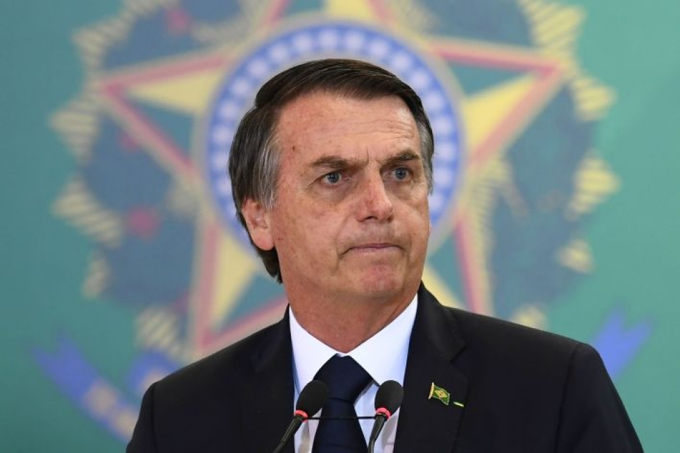 Presidentti Jair Bolsonaro vihjaa, että rahoituksen leikkauksista kärsineet ympäristöjärjestöt olisivat Brasilian metsäpalojen takana. LEHTIKUVA / AFP