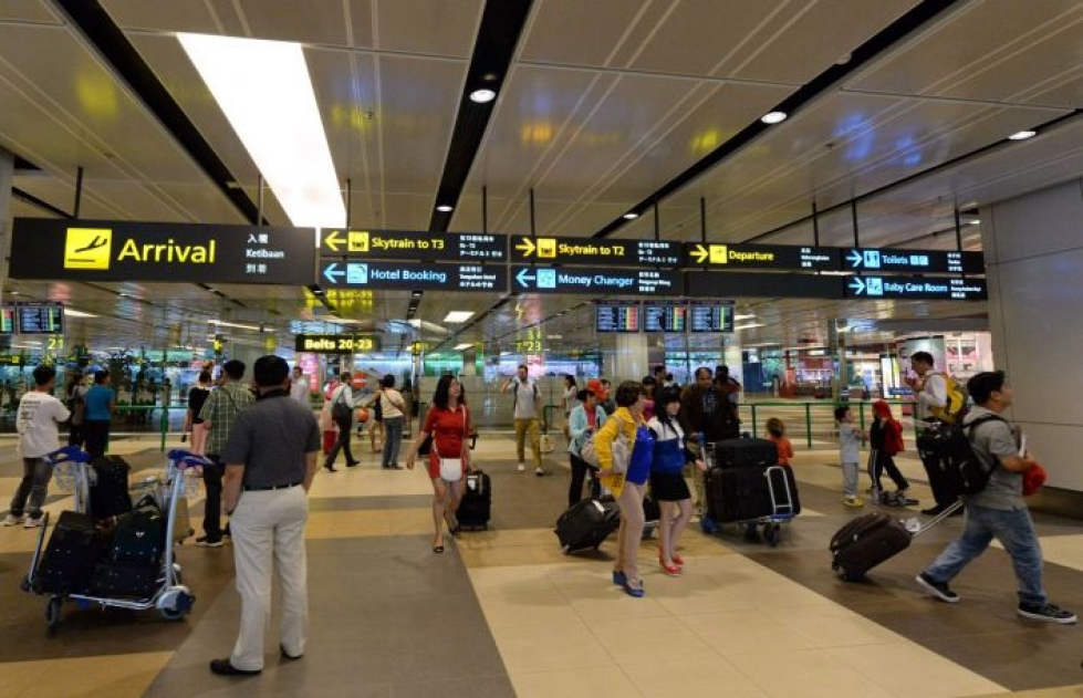 Malesiassa pidätetyt suomalaiset ovat lähteneet kotimatkalle Singaporen lentokentältä. Kuva: Lehtikuva/AFP