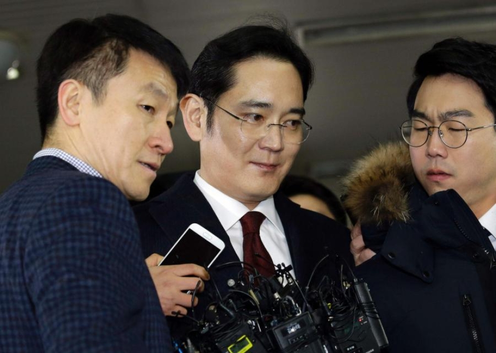 Leen epäillään antaneen Parkin hyvälle ystävälle Choi Soon-silille suuria summia lahjuksia. LEHTIKUVA/AFP