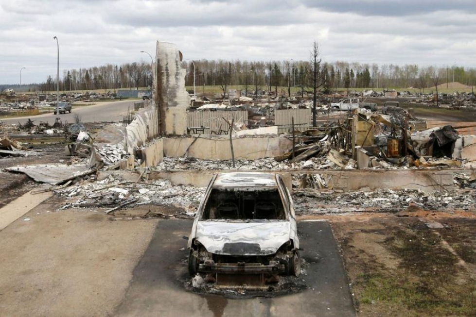 Albertan provinssissa sijaitseva Fort McMurray kärsi mittavia vahinkoja toukokuun alussa riehuneen maastopalon takia. LEHTIKUVA/AFP