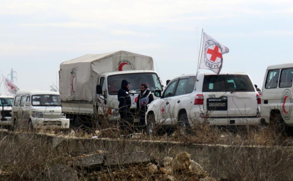 Punaisen Ristin ja Punaisen Puolikuun työntekijöitä Syyrian Aleppossa kuvattuna aiemmin joulukuussa. LEHTIKUVA/AFP